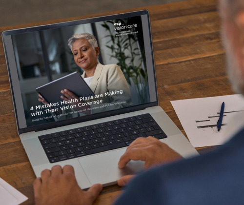 An image of the Medicare Vision Insights Report on a laptop