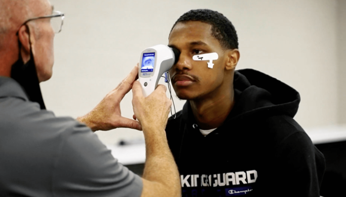 A young man undergoes an innovative eye care procedure.