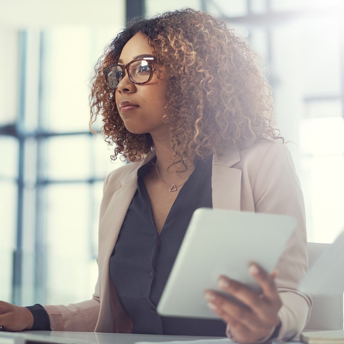 A woman looks at the Medicare Vision Insights Report on a computer